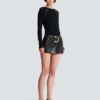 Mini-jupe en cuir avec ceinture