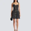 Robe en tweed à bretelles chaînes Robe en tweed à bretelles chaînes