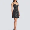 Robe en tweed à bretelles chaînes Robe en tweed à bretelles chaînes