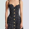 Robe en tweed à bretelles chaînes Robe en tweed à bretelles chaînes