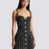 Robe en tweed à bretelles chaînes Robe en tweed à bretelles chaînes