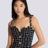 Robe en tweed à bretelles chaînes Robe en tweed à bretelles chaînes